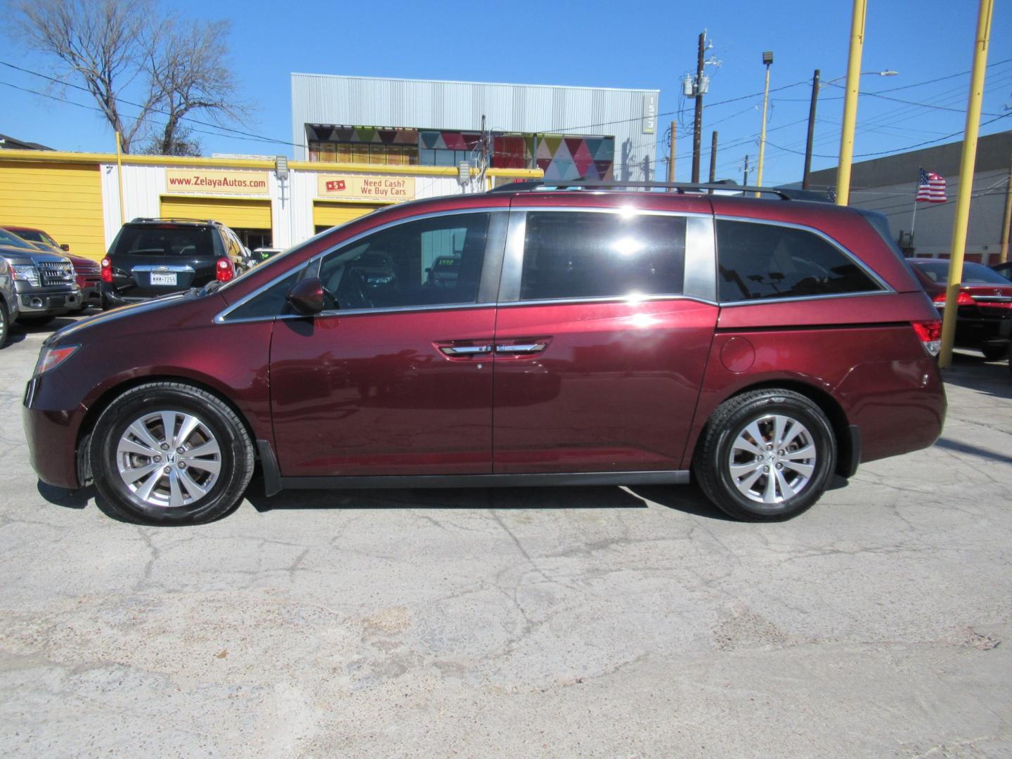 2016 Red /Tan Honda Odyssey EX-L (5FNRL5H62GB) with an 3.5L V6 SOHC 24V engine, Automatic transmission, located at 1511 North Shepherd Dr., Houston, TX, 77008, (281) 657-1221, 29.798361, -95.412560 - 2016 HONDA ODYSSEY EX-L VIN: 5FNRL5H62GB103369 5 F N R L 5 H 6 2 G B 1 0 3 3 6 9 VAN 3.5L V6 F SOHC 24V GASOLINE FRONT WHEEL DRIVE - Photo#32